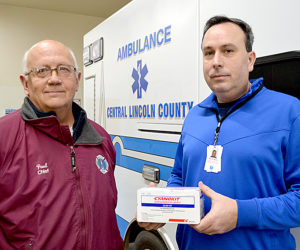 Bristol Fire Chief Paul Leeman Jr. (left) and Central Lincoln County Ambulance Service Chief Warren Waltz. Waltz holds a box of Cyanokit, a cyanide antidote. All five of the service's ambulances now carry Cyanokit thanks to a collaboration between the service and area fire departments. (Maia Zewert photo)