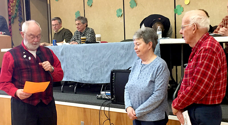 Whitefield Selectman Frank Ober (left) reads a statement about Spirit of America Award recipients Barbara and David Hayden during the annual town meeting Saturday, March 18. (Maia Zewert photo)