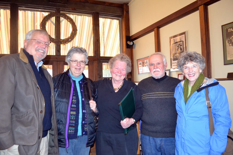 Le Garage owner Cheryl Rust (center) prepares to seat four friends at the restaurant. From left: David Sears, Judy Sears, Rust, Tom Rankin, and Susan Rankin. Rust will receive the Bill Zoidis Lifetime Achievement Award from the Maine Restaurant Association on March 28. (Charlotte Boynton photo)