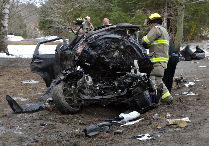 Damariscotta firefighters work at the scene of a single-vehicle accident on Bristol Road the afternoon of Tuesday, March 28. (Maia Zewert photo)