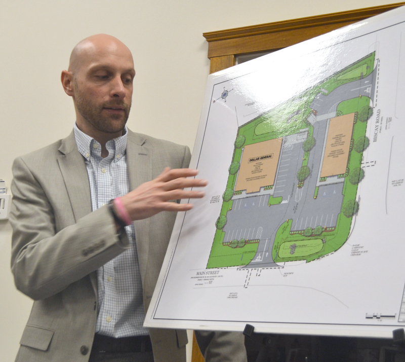 Austin Turner, a civil engineer with Bohler Engineering, discusses Damariscotta DG LLC's application to build a Dollar General store and a Sherwin-Williams store at the intersection of Main Street and Biscay Road during the Damariscotta Planning Board's Monday, April 3 meeting. (Maia Zewert photo)
