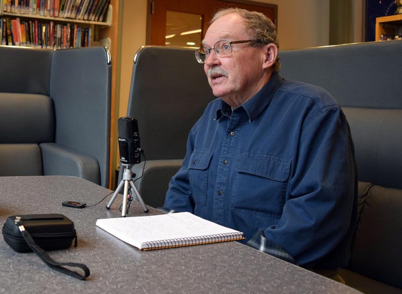 Bob Emmons, of South Bristol, records a podcast at Skidompha Library on Thursday, April 20. The retired professor has developed a following for his humorous stories and educational pieces on gardening and insects. (J.W. Oliver photo)