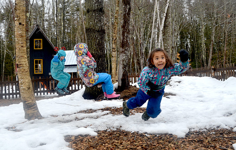 Luna Obregon (right) laughs while swinging alongside Meghan Arnold (left) and Allie Ferreira at Little House School on Abbie Lane in Damariscotta. (Maia Zewert photo)