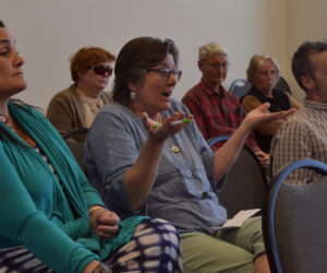 Amy Lalime (center) speaks during the Damariscotta Board of Appeals meeting Monday, April 24 as Jessica Sirois (left) and Gabe Shadis look on. Lalime, Shadis, and Sirois live near the Stepping Stone Housing Inc. property at the corner of Hodgdon and Pleasant streets in Damariscotta and are appealing the Damariscotta Planning Board's approval of a development at the site. (Maia Zewert photo)