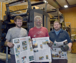 After working all night to complete the installation of two new color units, The Lincoln County News Publisher Chris Roberts (center) and Associate Publishers John Roberts (left) and Allan Roberts hold copies of the March 30 edition. (J.W. Oliver photo)