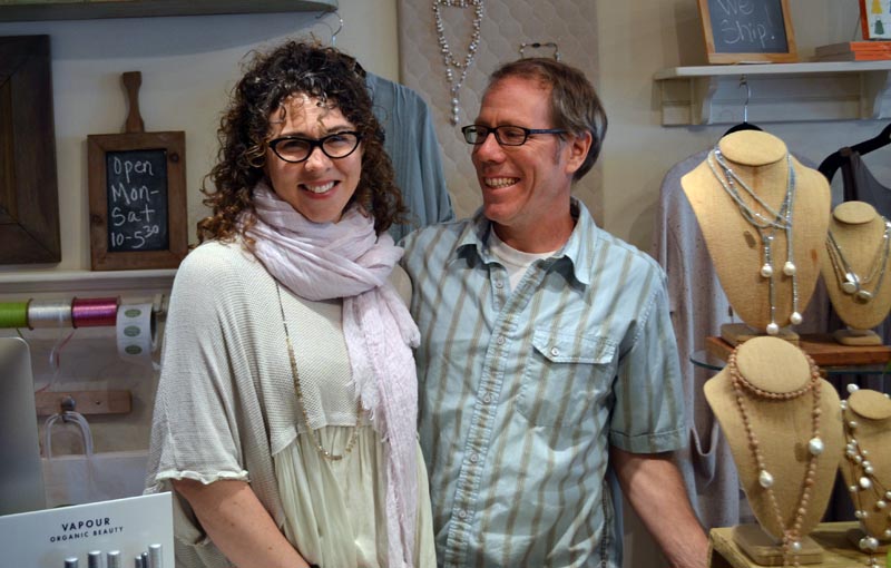 The new owners of In the Clover, Casey and Jay McNamara, prepare to open the store on Main Street in Wiscasset on Monday, April 24. (Abigail Adams photo)
