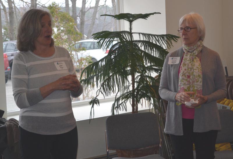 Midcoast Conservancy Executive Director Jody Jones (left) and board of directors Chair Susan Russell speak at an open house Wednesday, April 19. The nonprofit held the event to discuss the future of the Haggett Garage. (Abigail Adams photo)