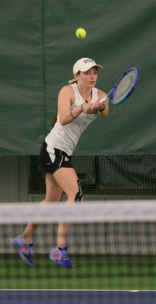 Lincoln Academy first singles player Emily Harris returns a backhand shot during her match against MCI at the CLC Y on April 26. (Paula Roberts photo)