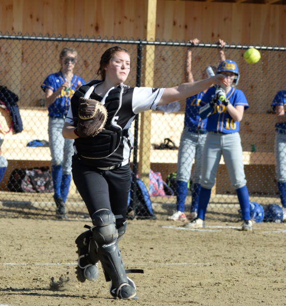 Lincoln Academy catcher Christine Hilton field a bunt and rifles a throw to first. )Paula Roberts photo)