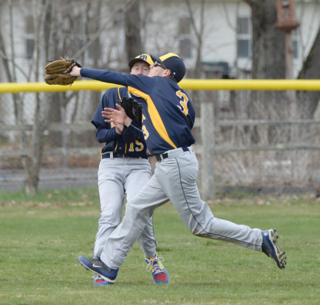 Patrick White makes the running catch in a near collision with center fielder Wyatt Post. (Paula Roberts photo)