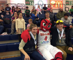 Lincoln Academy students Brie Wajer (front left) and Evan Eckel (right), CLC Y youth board members for 2015-2017, celebrate at the March 26 Maine Red Claws youth-volunteer recognition game, where they were each presented with a service certificate and a Maine Volunteer Service medallion.