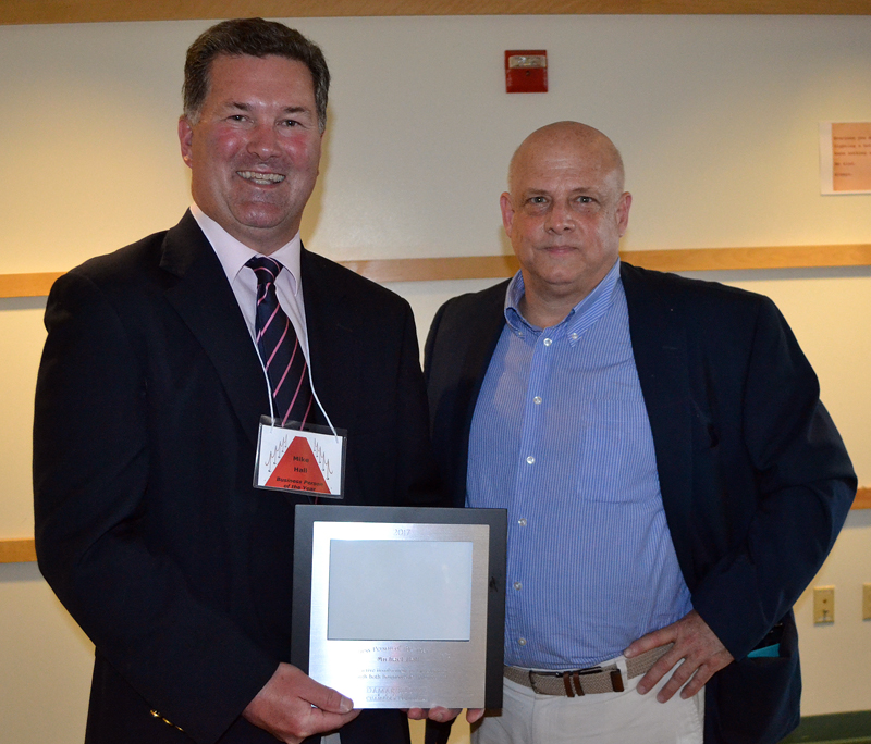 Hall Funeral Home President Mike Hall was presented the Damariscotta Region Chamber of Commerce's Business Person of the Year Award by outgoing board member John Bottero during the chamber's annual meeting Thursday, May 18. (Maia Zewert photo)