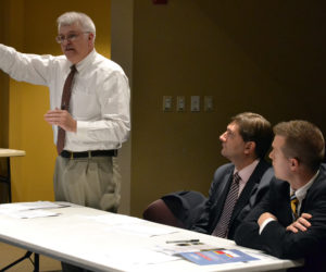 From left: State Rep. Mick Devin, D-Newcastle, speaks about legislative Democrats' alternative to Gov. Paul LePage's biennial budget proposal during a town hall-style forum at Skidompha Library the evening of Thursday, May 4 as Senate Minority Leader Troy Jackson, D-Allagash, and Assistant House Majority Leader Jared Golden, D-Lewiston, look on. (Maia Zewert photo)