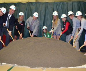 The CLC YMCA ceremonially breaks ground on the first phase of its expansion project during its annual meeting Tuesday, May 9. From left: John Scott, of J.F. Scott Construction Co.; CLC YMCA Board of Directors Chair Dennis Anderson and CEO Megan Hamblett; architect Tor Glendinning, Y member Reese Nelson, Y staff member Molly Saunders, Janice Sprague, Jacob Masters, and Brie Wajer and Evan Eckel, the youth representatives on the Y board. (Maia Zewert photo)