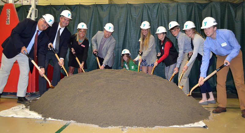 The CLC YMCA ceremonially breaks ground on the first phase of its expansion project during its annual meeting Tuesday, May 9. From left: John Scott, of J.F. Scott Construction Co.; CLC YMCA Board of Directors Chair Dennis Anderson and CEO Megan Hamblett; architect Tor Glendinning, Y member Reese Nelson, Y staff member Molly Saunders, Janice Sprague, Jacob Masters, and Brie Wajer and Evan Eckel, the youth representatives on the Y board. (Maia Zewert photo)