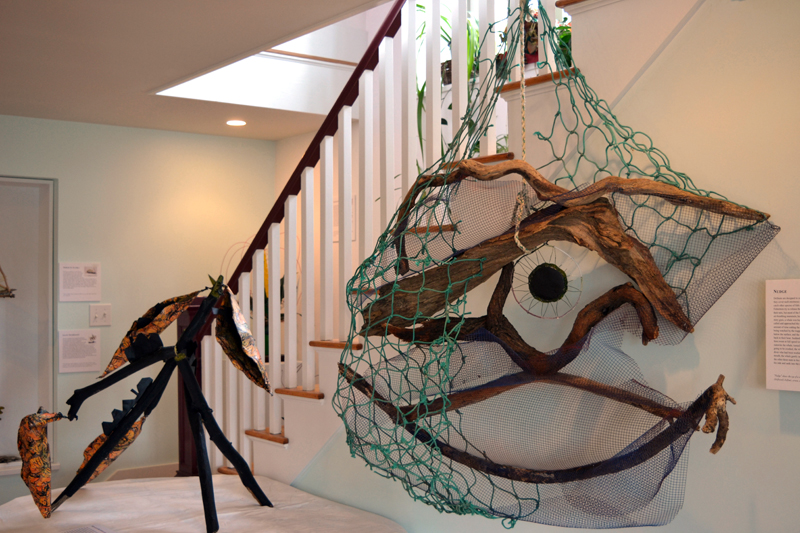 From left: Eco-artist Marnie Sinclair's large pieces "Monarch Butterflies" and "Nudge" grace the area near the stairs at Deb Poor's house-turned-gallery in Newcastle. (Christine LaPado-Breglia photo)