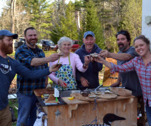 From left: Chase Morrill, Adam Myer, Sharon and Leigh Morrill, Ryan Eldridge, and Ashley Morrill-Eldridge enjoy oysters at the Morrills' home after completing filming for "Maine Cabin Masters" for the day Friday, April 28. (Abigail Adams photo)