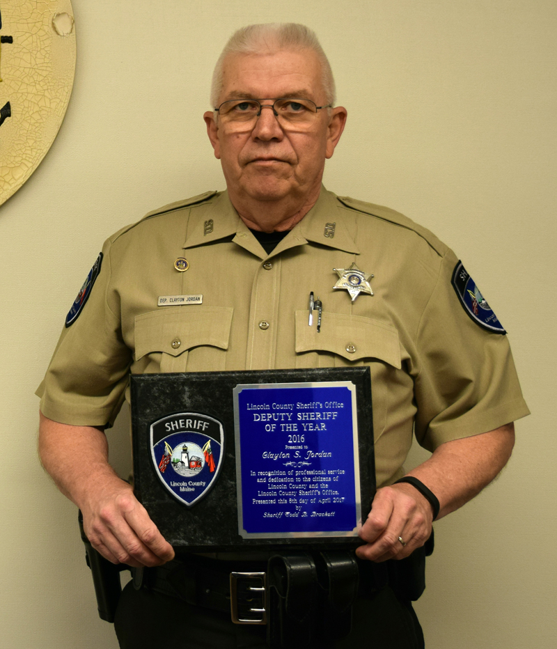 Lincoln County Sheriff's Deputy Clayton Jordan holds his Deputy Sheriff of the Year plaque in District Court in Wiscasset on May 5. (J.W. Oliver photo)