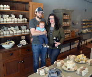 Long Winter Farm Soap Co. owners Lucas McNelly and Amanda Nelson and their son, Rhys McNelly, in their new store at 11 Friendship St. in Waldoboro. The store will celebrate its grand opening Saturday, May 6. (Maia Zewert photo)