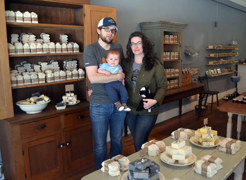 Long Winter Farm Soap Co. owners Lucas McNelly and Amanda Nelson and their son, Rhys McNelly, in their new store at 11 Friendship St. in Waldoboro. The store will celebrate its grand opening Saturday, May 6. (Maia Zewert photo)