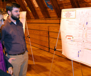 Wiscasset resident Susan Robson reviews a diagram of the parking proposal for the Wiscasset downtown traffic project with Steve Bates, of VHB, during a public hearing Monday, May 8. (Abigail Adams photo)