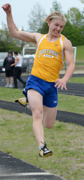 Draco Peaslee competes in the long jump for Boothbay. (Paula Roberts photo)