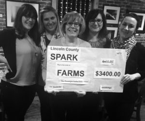 From left: Brynne Hanna, Taylor Corson, Jean Kerrigan, Cerina Leeman, and Annie Avantaggio,as Avantaggio presents a check to Kerrigan, who is a FARMS board member.