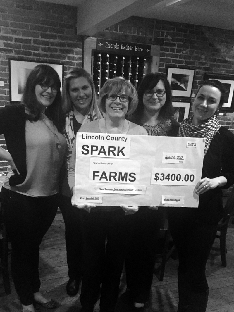 From left: Brynne Hanna, Taylor Corson, Jean Kerrigan, Cerina Leeman, and Annie Avantaggio,as Avantaggio presents a check to Kerrigan, who is a FARMS board member.