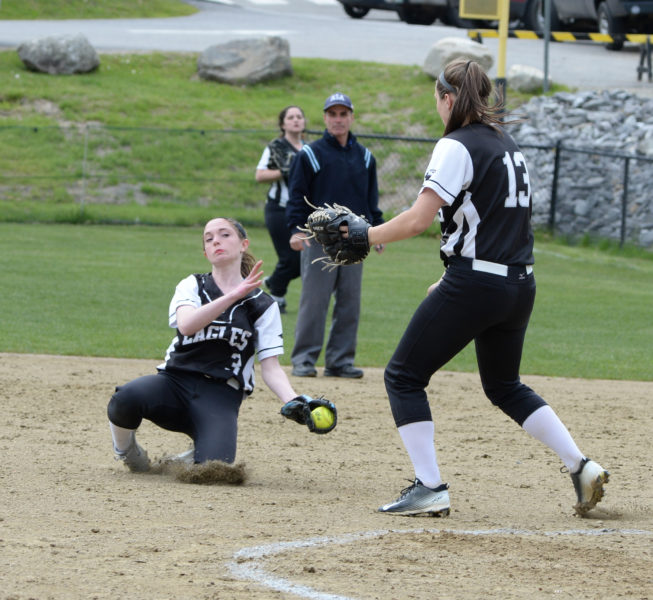 Madeline York makes a diving catch on a pop-fly behind Eagle catcher Kortney Mckenna. (Paula Roberts photo)