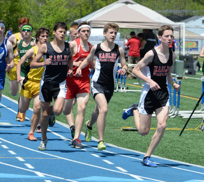 Lincoln Academy runs in a pack at the KVAC mile championship. Sam Russ  (right) won the league crown, David Barnum (middle) placed second and Jarrett Gulden took sixth.  In the 3200, Russ placed first, Barnum second and Gulden fourth. (Paula Robert photo)