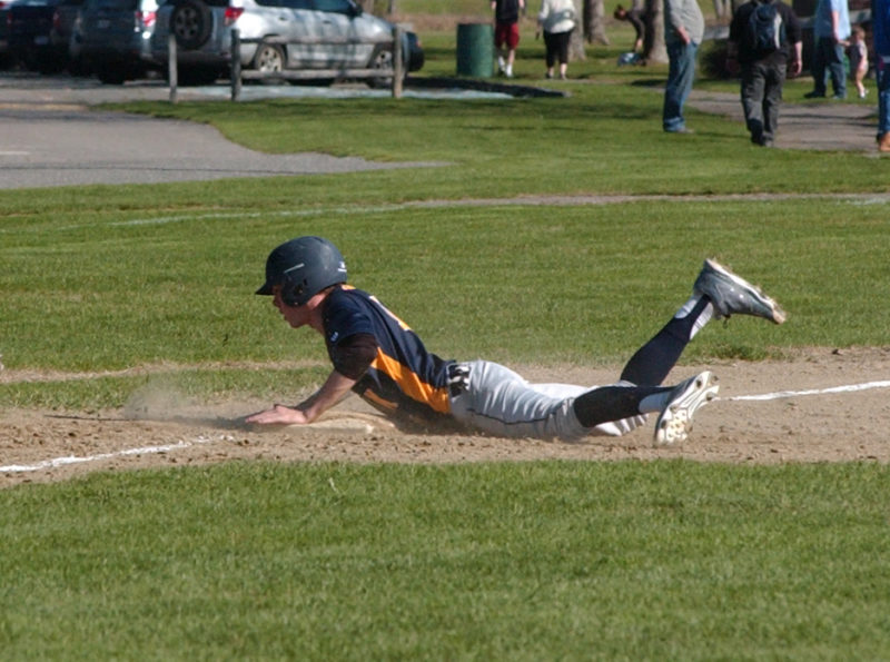 Adam Eutsler dives into third safe for the Panthers. (Carrie Reynolds photo)