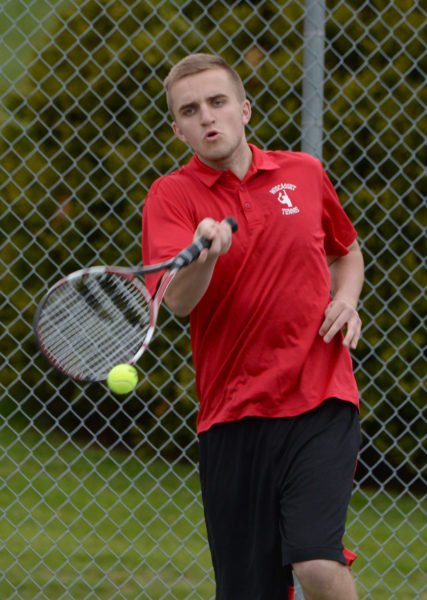 Wiscasset senior Ethan James returns a shot in boys tennis action on May 10. (Paula Roberts photo)