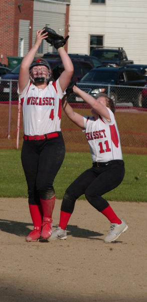 Sydnie Thayer holds onto the ball for the catch with a collision with Wiscasset teammate Maeve Blodgett. (Carrie Reynolds photo)