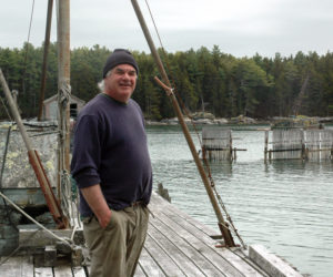 Community Shellfish LLC owner Boe Marsh stands on the dock of the Bremen Lobster Pound Co-Op on Keene Neck in Bremen. (Alexander Violo photo)