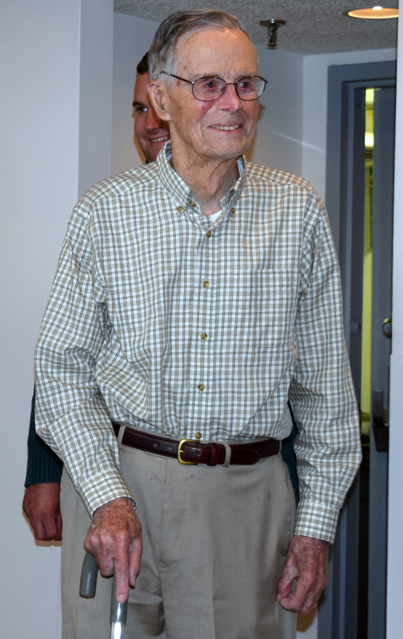 Harry Emmons arrives for his 100th birthday party in the Schooner Cove dining room Friday, June 9. (J.W. Oliver photo)