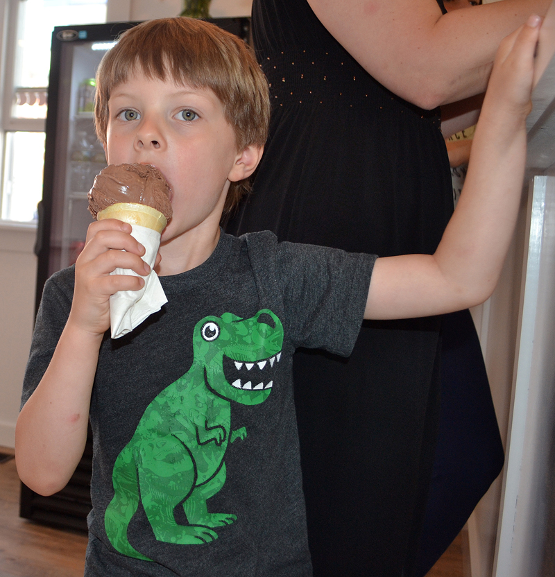 Michael Kastelein, 4, of Damariscotta, enjoys an ice cream cone at Wicked Scoops in downtown Damariscotta. (Maia Zewert photo)