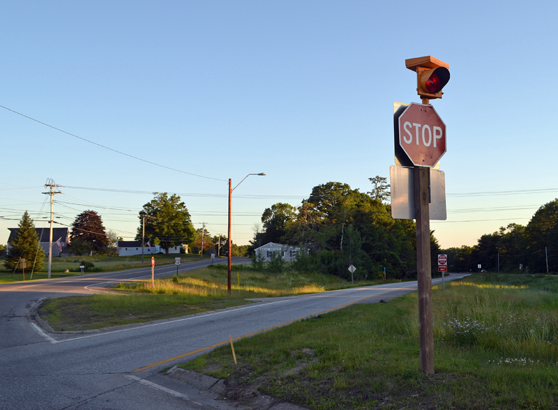 A flashing red light atop the stop sign at the intersection of Route 1 and Main Street in Damariscotta fulfills the first recommendation of a committee that reviewed the safety of two Route 1 intersections. (Maia Zewert photo)