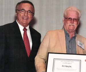 R.H. Reny Inc. President John Reny (right) receives an award for outstanding safety performance during the Maine Employers Mutual Insurance Co.s annual meeting of policyholders in early June.