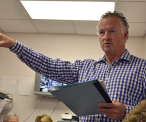 Jack Freker, one of the members of The Standard of Newcastle Condominium Association, talks about Kieve-Wavus Education Inc.'s plans to purchase the boathouse behind the condominium building during the Newcastle Board of Selectmen's meeting Monday, June 12. (Maia Zewert photo)