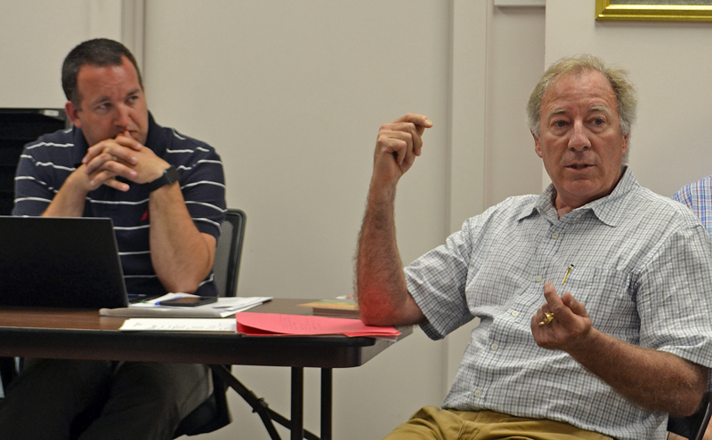 Kieve-Wavus Education Inc. Executive Director Henry Kennedy (right) discusses the organization's plans for the boathouse as Newcastle Town Administrator Jon Duke looks on. (Maia Zewert photo)