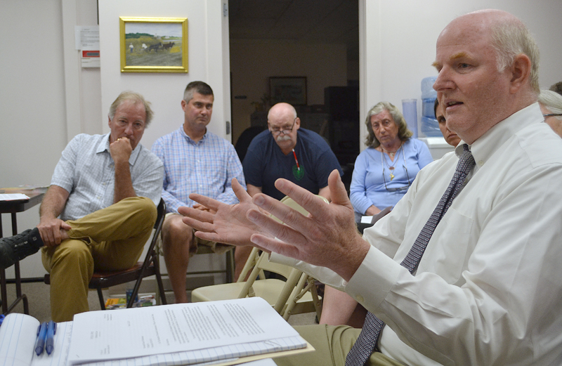 Hylie West, the attorney for The Standard of Newcastle Condominium Association, discusses the association's objection to Kieve-Wavus Education Inc.'s plans for the boathouse as Kieve-Wavus Executive Director Henry Kennedy (left) looks on. (Maia Zewert photo)