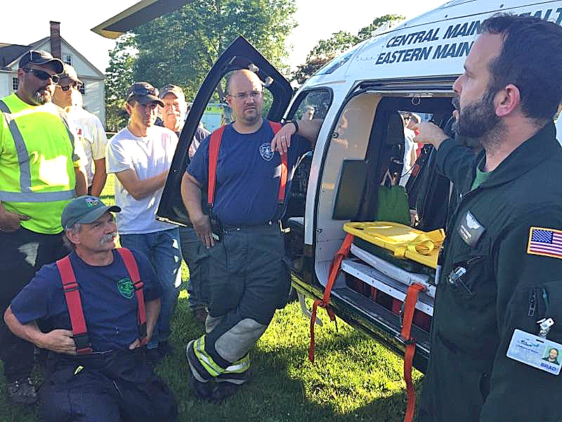 LifeFlight nurse Brad Boehringer (right) talks about the medical equipment each LifeFlight helicopter carries during a question-and-answer session with Lincoln County firefighters Tuesday, June 20. (Maia Zewert photo)