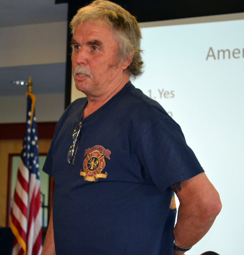 Newcastle firefighter Richard Gutek speaks against a motion to eliminate a raise for the fire chief at annual town meeting Wednesday, June 14. (Abigail Adams photo)