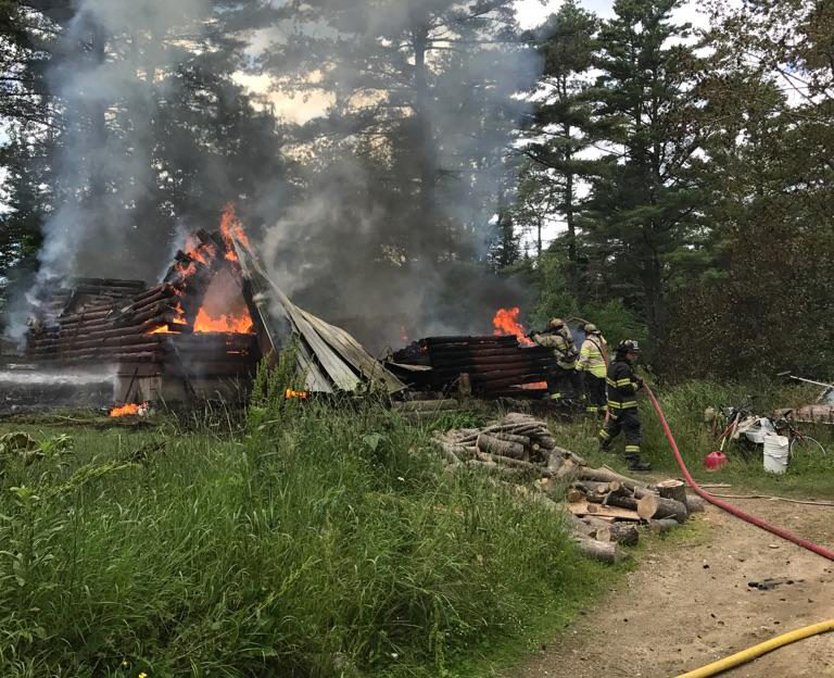 Firefighters work to extinguish a fire that destroyed a Bradford Road home in Wiscasset the afternoon of Wednesday, June 28. (photo courtesy Wiscasset Police Department)