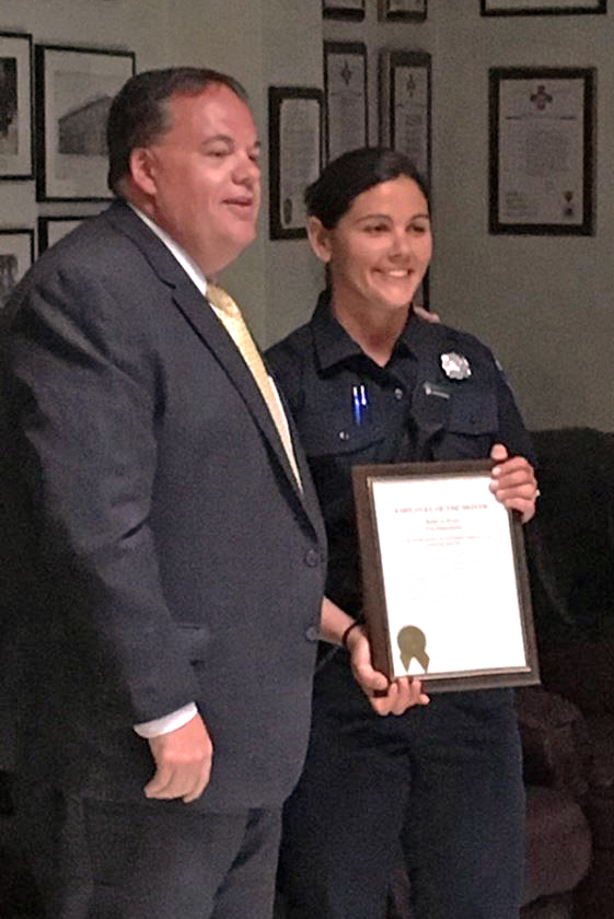 Portland City Manager Jon Jennings presents Wiscasset resident Bobbi Jo Weeks with Portland's April Employee of the Month Award on May 22 for her work on the Portland Fire Department. (Photo courtesy Portland Fire Department)