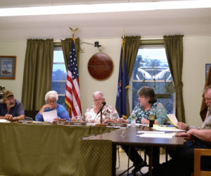 The Wiscasset Board of Selectmen votes to place the harbor master and shellfish warden under the authority of the police department Tuesday, June 27. From left: Selectmen Robert Blagden, Katharine Martin-Savage, and Judy Colby; Town Manager Marian Anderson; and Selectmen Benjamin Rines Jr. and Jefferson Slack. (Charlotte Boynton photo)