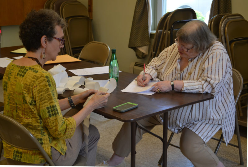 From left: Wiscasset Election Clerk Joan Barnes and Election Warden Susan Blagden retally the results of Wiscasset's annual town meeting by referendum at the Wiscasset town office on Thursday, June 22. (Abigail Adams photo)