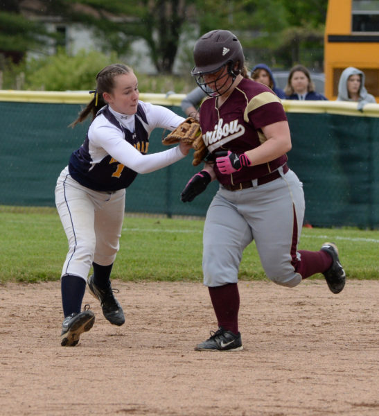 Kayla Donlin tags out Taylor Devoe, then through to first to complete a double play in the fourth inning. (Paula Roberts photo)