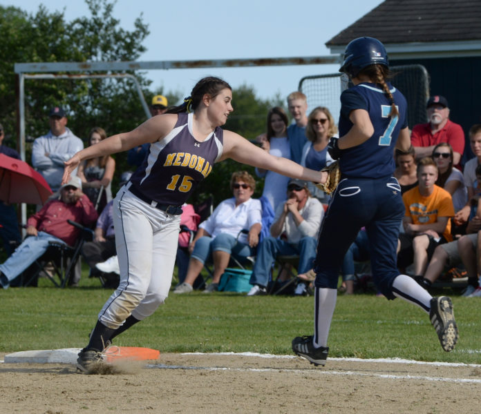 Medomak Valley first baseman Lydia Simmons takes out Oceanside'sAbby Veilleux. (Paula Roberts photo)