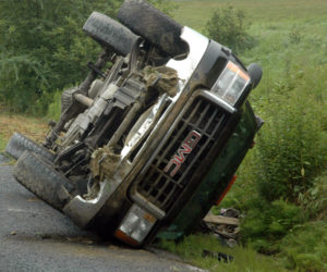 A GMC pickup rests on its side after a rollover in Bremen the morning of Tuesday, July 18. (Alexander Violo photo)